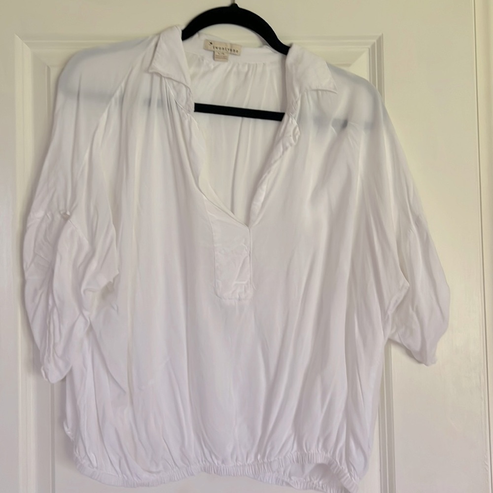 White loosefitting blouse